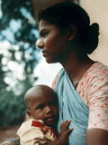 Bild: Eine Adivasi-Frau mit ihrem Kind, Rechte: dpa Bild: Eine Adivasi-Frau mit ihrem Kind, Rechte: dpa