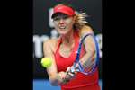 Maria Sharapova of Russia makes a backhand return to Peng Shuai of China during their fourth round match at the Australian Open tennis championship in Melbourne, Australia.